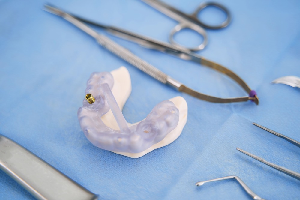 teeth model with metal implant and dental tools 2022 03 31 17 41 56 utc 1